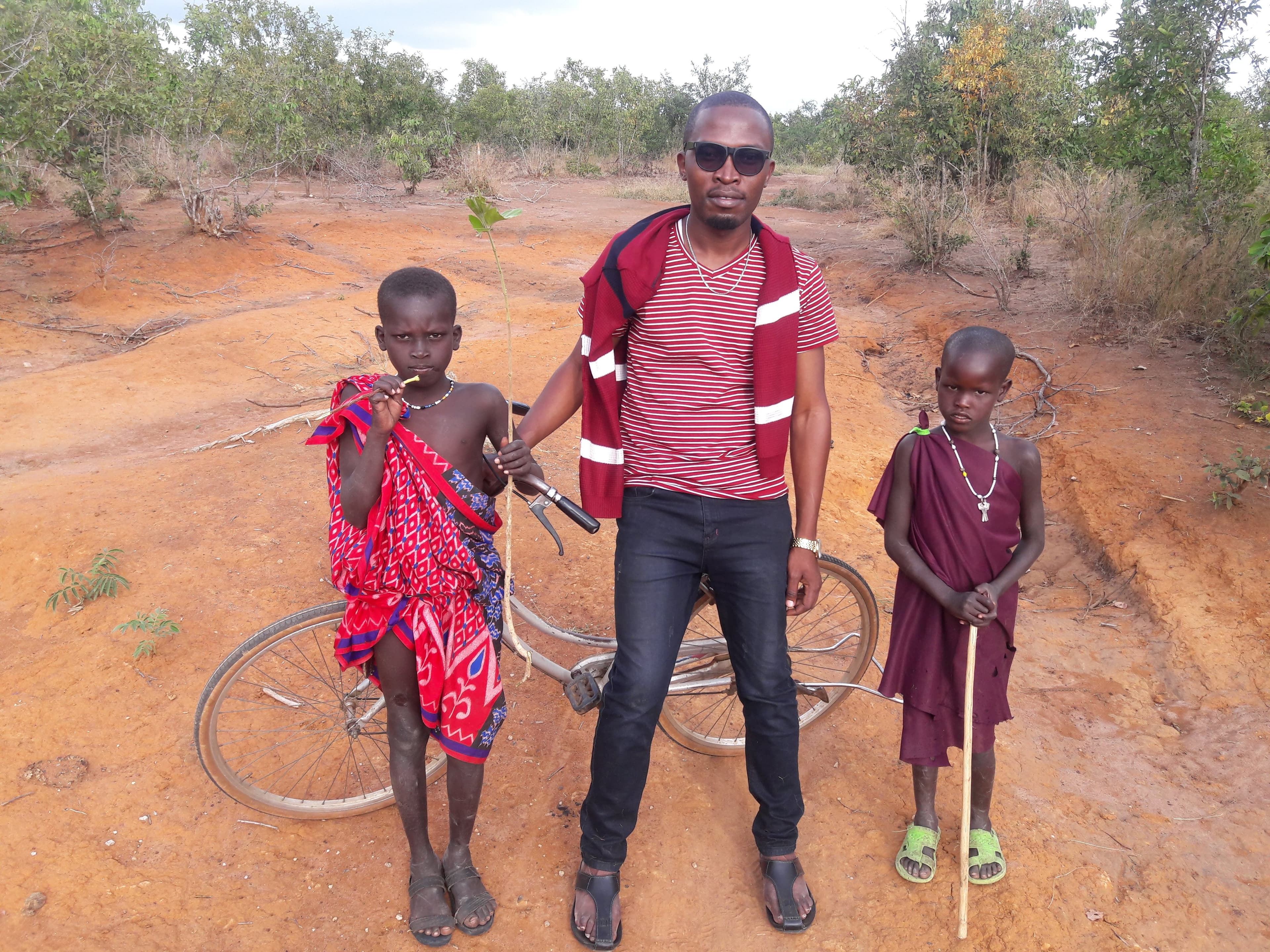 Godson with children in rural Tanzania