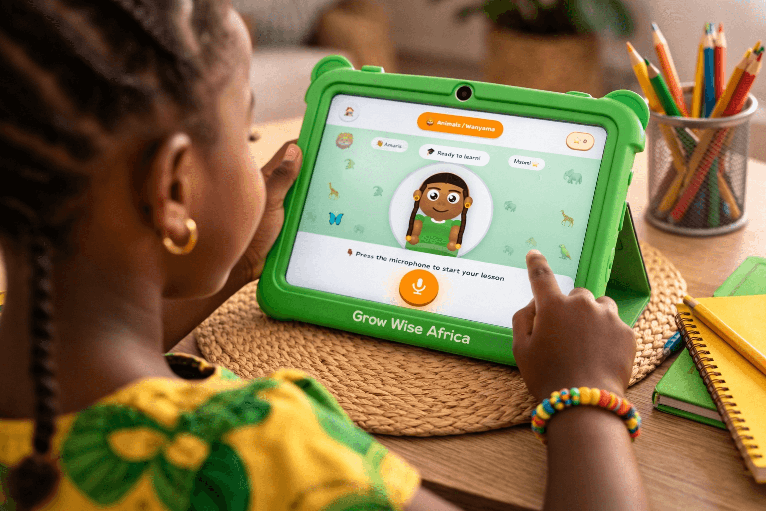 Child using Ticha on a Grow Wise Africa tablet